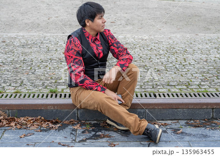 Man sitting in profile Man sitting in profile 135963455