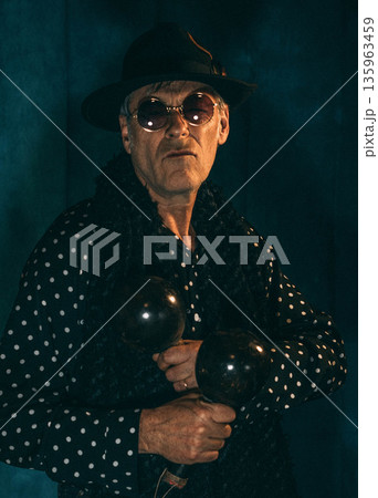 Musician with maracas and hat Musician with maracas and hat 135963459