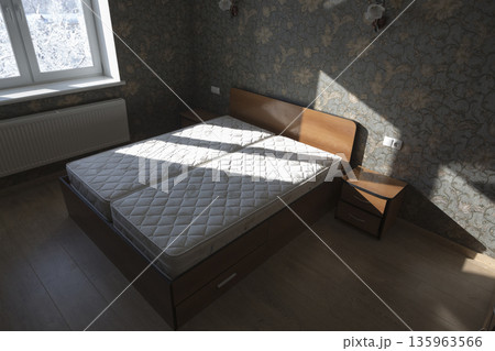 Bed in the bedroom with mattresses in the room 135963566
