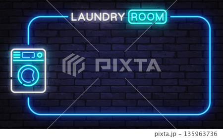Neon laundry room sign with washing machine icon on brick wall. Home service concept perfect for interiors, rentals, or facility signage. 135963736