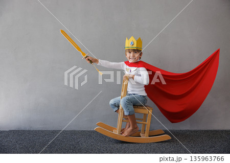 Funny child pretend to be knight. Happy kid having fun at home Funny child pretend to be knight. Happy kid having fun at home 135963766