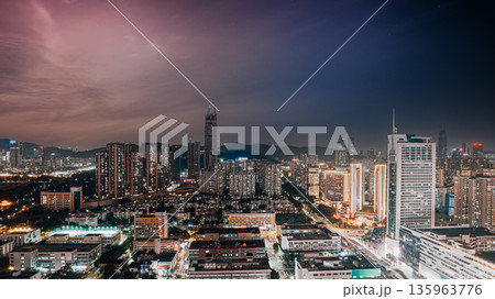 Shenzhen downtown night cityscape with busy urban blocks 135963776