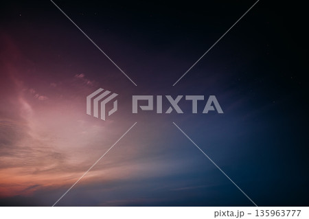 Pink and purple twilight sky with wispy clouds 135963777