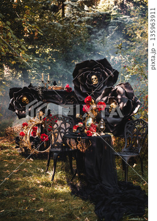 Dark Romantic Still Life with Black Roses and Antique Mirror 135963911