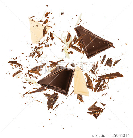 Flying dark and white chocolate pieces with scattered shards isolated on white background 135964814