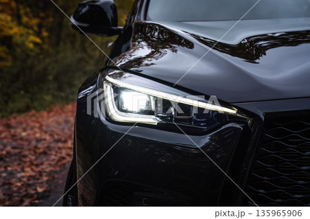 Front Car Headlight with LED Light in Autumn Forest 135965906