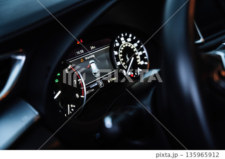 Modern Car Dashboard with Digital Instrument Cluster at Night 135965912