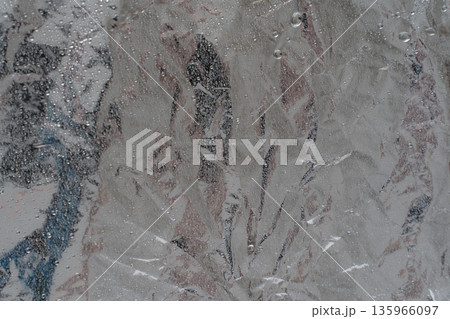 Wet crumpled aluminum foil texture with water droplets 135966097