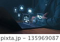 Person using a laptop with digital icons representing law, justice, communication, and business, including scales, handshake, and courthouse symbols, illustrating legal technology and digital ethics. 135969087