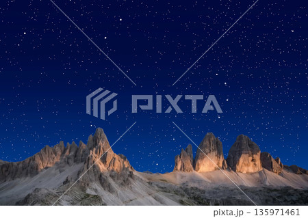 night landscape with stars and moon, milky way and galaxy in the mountains. beautiful nature background. night landscape with stars and moon, milky way and galaxy in the mountains. beautiful nature background. 135971461