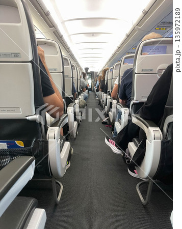Internal view of the cabin of a passenger plane Internal view of the cabin of a passenger plane 135972189