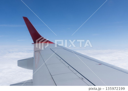 View from the plane wing and clouds, Italy View from the plane wing and clouds, Italy 135972199