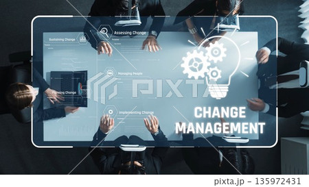 Visual Representation of Change Management Processes featuring a Diverse Group Collaborating Around a High-Tech Table with Infographic Elements. Raster 135972431