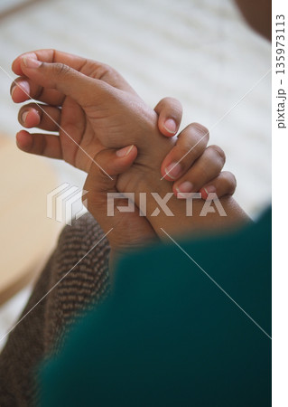 young woman suffering wrist pain. young woman suffering wrist pain. 135973113