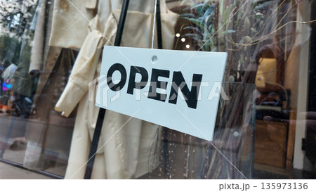 Sign shows open store, welcoming customers inside Sign shows open store, welcoming customers inside 135973136