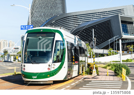 The circular light rail train drives past the Kaohsiung Port Cruise Terminal station in Taiwan. The circular light rail train drives past the Kaohsiung Port Cruise Terminal station in Taiwan. 135975808