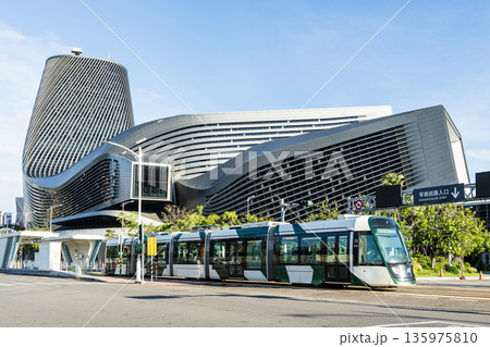 The circular light rail train drives past the Kaohsiung Port Cruise Terminal station in Taiwan. 135975810