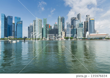 Building view of modern skyscrapers along Marina Bay in the Raffles Place financial district from the Marina Bay Sands observation deck, Singapore. Building view of modern skyscrapers along Marina Bay in the Raffles Place financial district from the Marina Bay Sands observation deck, Singapore. 135976834
