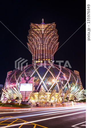 Beautiful night view of the Grand Lisboa building, the most famous, richest casino, and a luxury hotel resort stands in Macau. Beautiful night view of the Grand Lisboa building, the most famous, richest casino, and a luxury hotel resort stands in Macau. 135976849