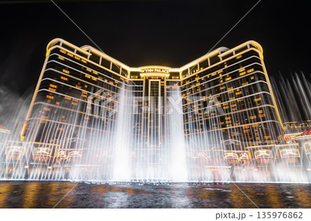 Beautiful night view of Wynn Palace Performance Lake displays a water, music, and light show, is a hotel casino resort on the Cotai Strip in Macau, China. 135976862