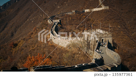 Tourists Walking on Great Wall of China at Mutianyu during golden autumn hours ( 135977361