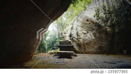 Peaceful Buddha Amidst Rocks in Nature's Embrace Peaceful Buddha Amidst Rocks in Nature's Embrace 135977365