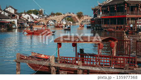 Captivating Scene of a Traditional Town with Water, Boats, and Historic Bridge. Zhujiajiao, Shanghai, China 135977368