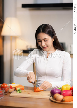 Fit woman enjoys healthy fruit breakfast after yoga training. fitness, nutrition, home lifestyle. Fit woman enjoys healthy fruit breakfast after yoga training. fitness, nutrition, home lifestyle. 135977957