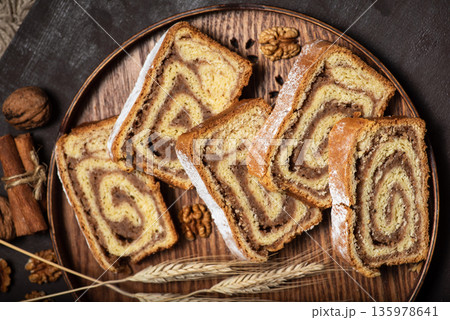Sliced of walnut roll Sliced of walnut roll 135978641