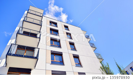 Luxury house complex of flats in condo area. Part of city real estate property, condo architecture on a sunny day no people. Luxury house complex of flats in condo area. Part of city real estate property, condo architecture on a sunny day no people. 135978930