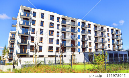 Luxury house complex of flats in condo area. Part of city real estate property, condo architecture on a sunny day no people. Luxury house complex of flats in condo area. Part of city real estate property, condo architecture on a sunny day no people. 135978945