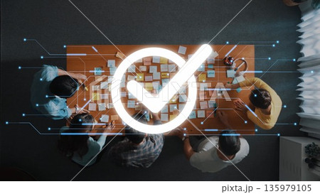 Team Collaboration and Brainstorming Session with Digital Overlay of Success Checkmark Icon in Modern Office Environment. Raster Team Collaboration and Brainstorming Session with Digital Overlay of Success Checkmark Icon in Modern Office Environment. Raster 135979105
