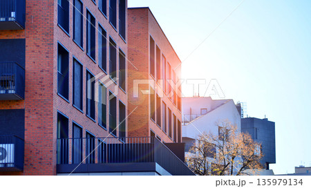 Luxury house complex of flats in condo area. Part of city real estate property, condo architecture on a sunny day no people. Luxury house complex of flats in condo area. Part of city real estate property, condo architecture on a sunny day no people. 135979134