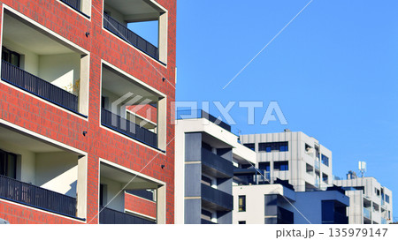 Luxury house complex of flats in condo area. Part of city real estate property, condo architecture on a sunny day no people. Luxury house complex of flats in condo area. Part of city real estate property, condo architecture on a sunny day no people. 135979147