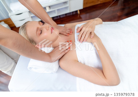 Caucasian woman customer enjoying relaxing anti-stress massage. Quiescent 135979378