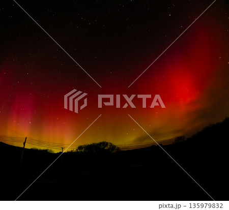 The Aurora Borealis, the northern lights, showing up above bungalow in County Donegal, Ireland The Aurora Borealis, the northern lights, showing up above bungalow in County Donegal, Ireland 135979832