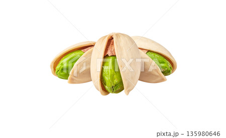 Delicious salted pistachios with green kernels and brown shells are placed on a white background. Delicious salted pistachios with green kernels and brown shells are placed on a white background. 135980646