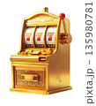 A slot machine with three spinning reels and the number seven, separated on a white background. 135980781