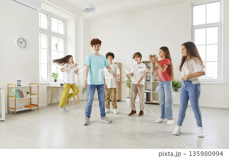 Students Playing Together During Break In School Classroom 135980994