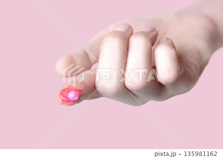 A drop of capsule pink cream on the finger of a woman. Swatch of pink popular Niacinamide Capsule Cream. isolated on pink background photo A drop of capsule pink cream on the finger of a woman. Swatch of pink popular Niacinamide Capsule Cream. isolated on pink background photo 135981162