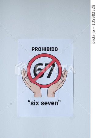 Sign on the white wall prohibition meme phrase six seven in Spanish Sign on the white wall prohibition meme phrase six seven in Spanish 135982528