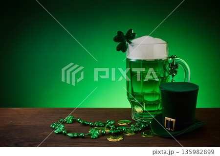 St. Patrick's day green beer celebration with shamrock and hat St. Patrick's day green beer celebration with shamrock and hat 135982899