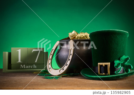 St. Patrick's day celebration with leprechaun hat and pot of gold St. Patrick's day celebration with leprechaun hat and pot of gold 135982905