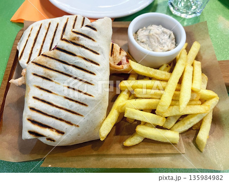 Shawarma with tartar sauce and French fries Shawarma with tartar sauce and French fries 135984982