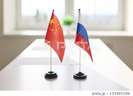 Desk flags of China and Russia on meeting table, symbol of international diplomacy Desk flags of China and Russia on meeting table, symbol of international diplomacy 135985299