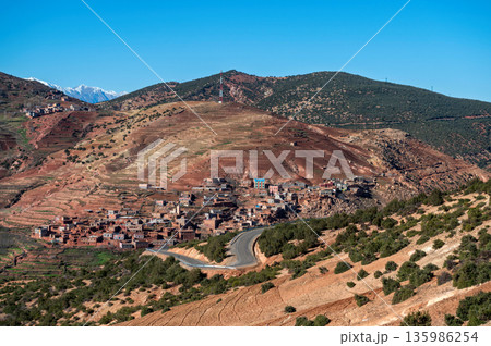 Vibrant landscape of Atlas Mountains in Morocco with traditional villages and winding roads Vibrant landscape of Atlas Mountains in Morocco with traditional villages and winding roads 135986254