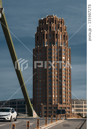 Modern urban architecture with tall brick tower Modern urban architecture with tall brick tower 135987278