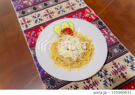 A dish on a plate. A dish on a plate. 135990631