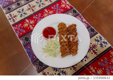 A dish on a plate. 135990632