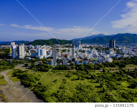Flying over a coastal city. Flying over a coastal city. 135991170